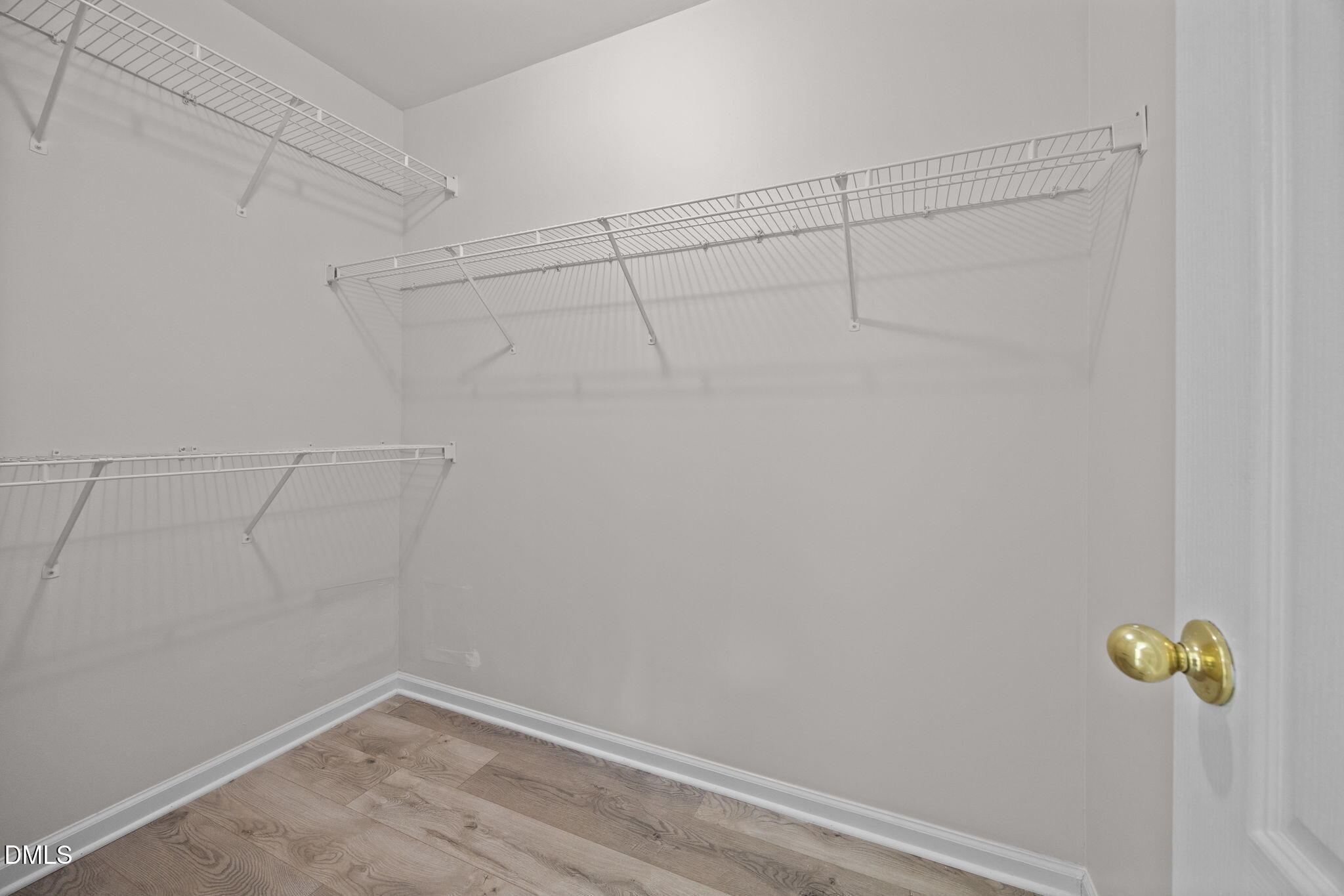 104 Saddle River Road Apex, NC 27502 - Photo 17 of 42 a view of a room with racks on the wall