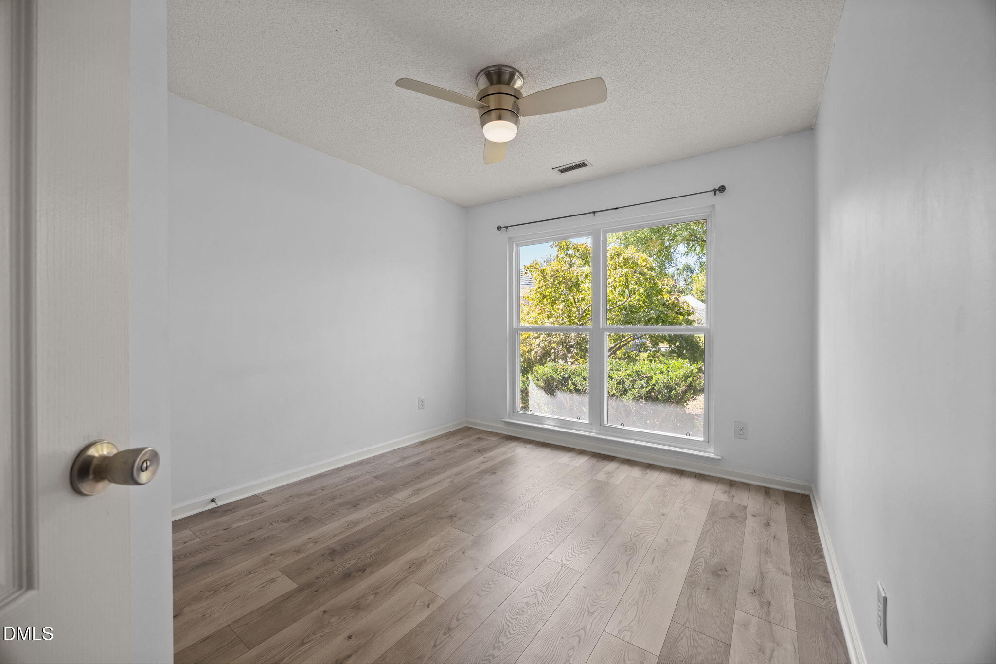 104 Saddle River Road Apex, NC 27502 - Photo 18 of 42 an empty room that has a window