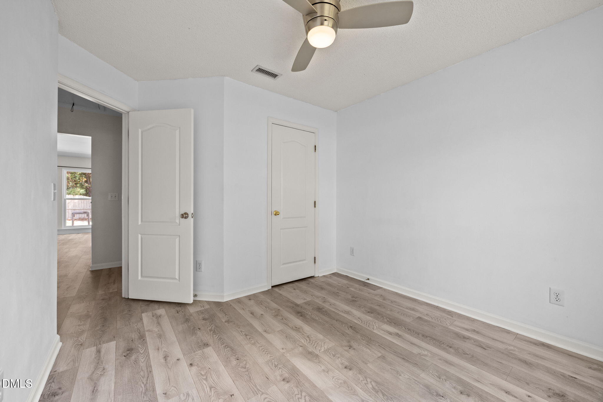 104 Saddle River Road Apex, NC 27502 - Photo 19 of 42 a view of empty room with wooden floor