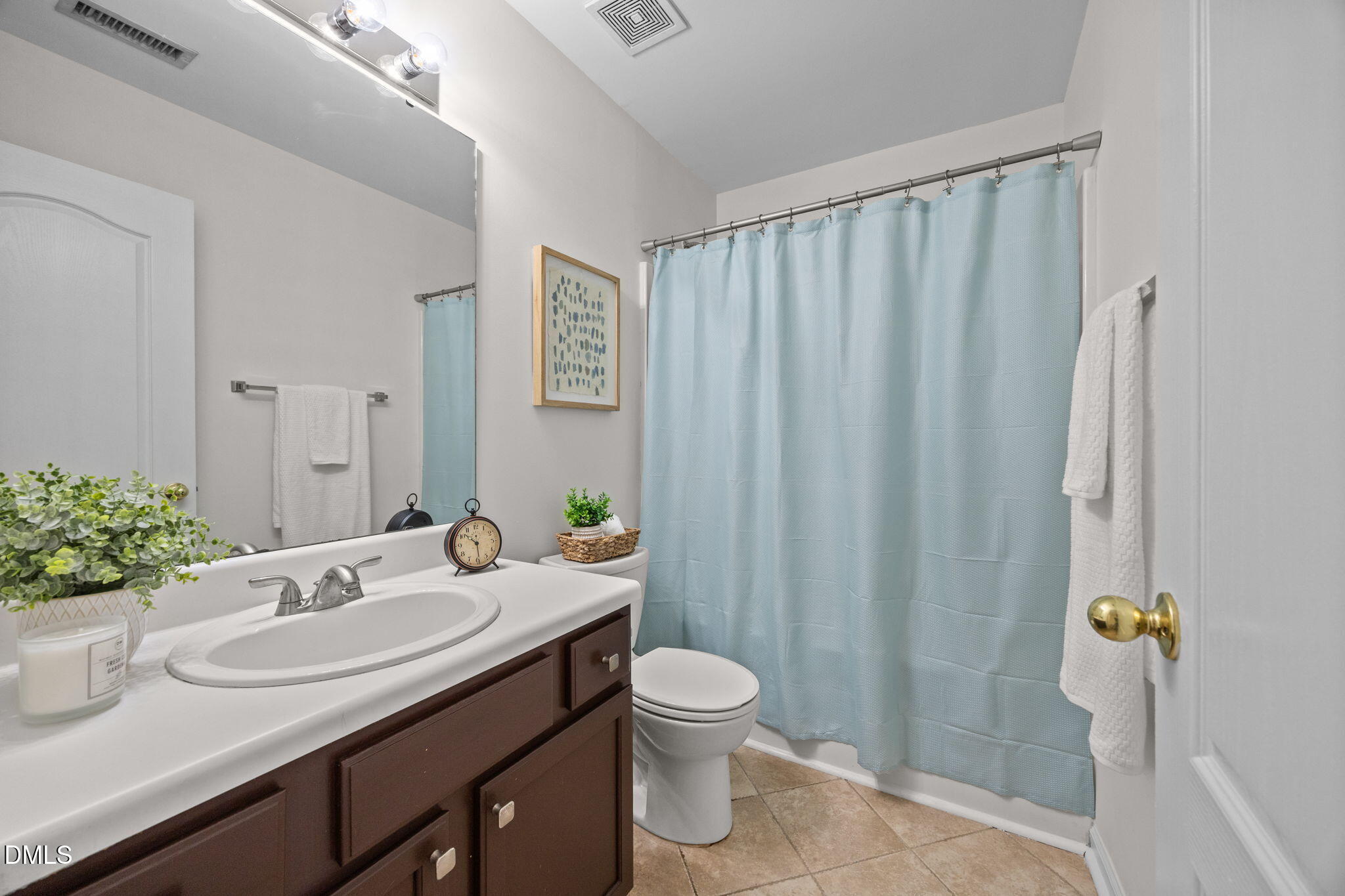 104 Saddle River Road Apex, NC 27502 - Photo 20 of 42 a bathroom with a granite countertop sink and a mirror