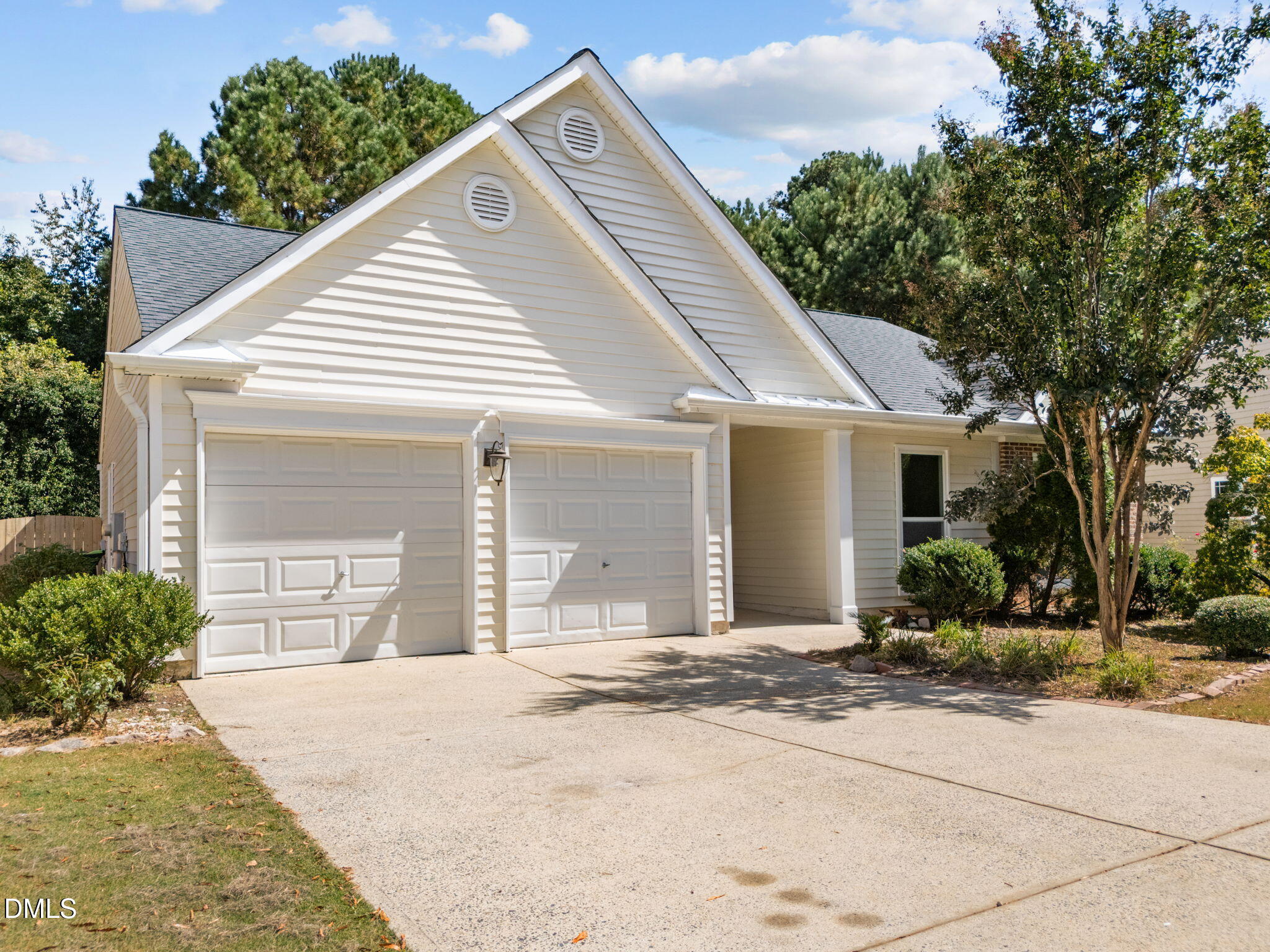 104 Saddle River Road Apex, NC 27502 - Photo 2 of 42 a view of a white house with a outdoor space