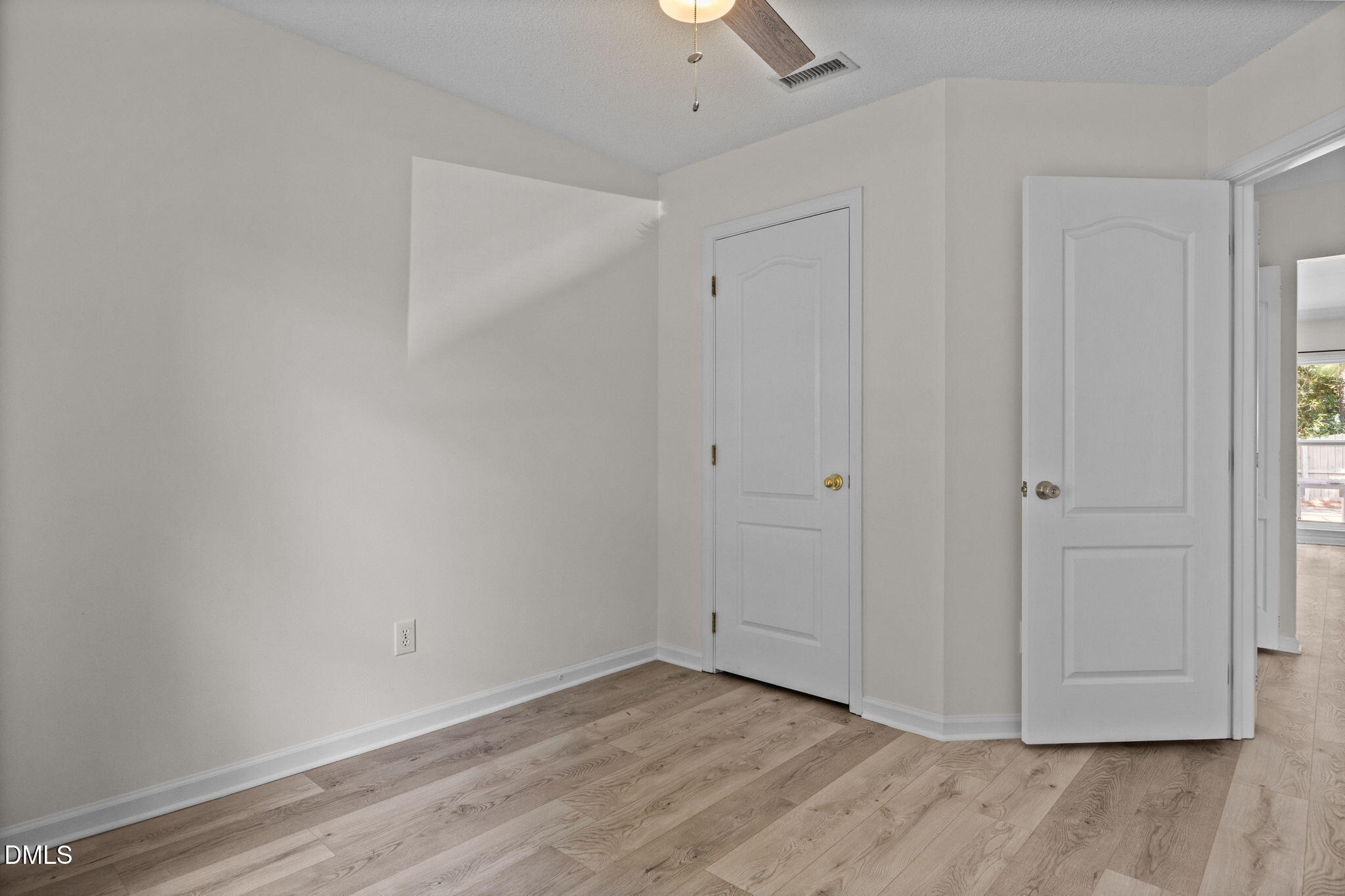104 Saddle River Road Apex, NC 27502 - Photo 21 of 42 a view of an empty room with wooden floor