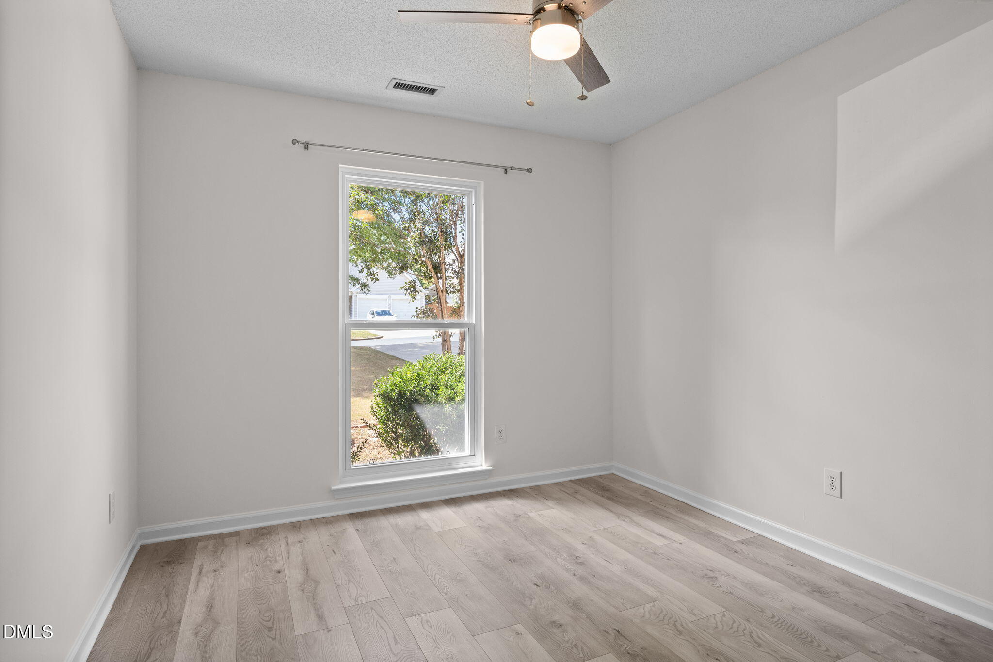 104 Saddle River Road Apex, NC 27502 - Photo 22 of 42 an empty room with windows