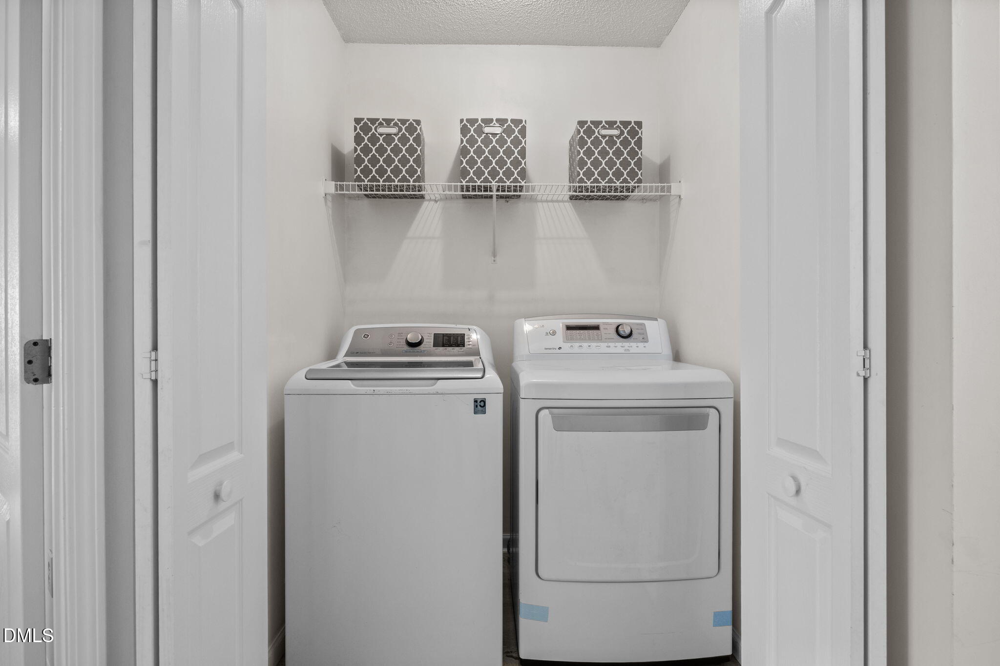 104 Saddle River Road Apex, NC 27502 - Photo 23 of 42 a utility room with dryer and washer
