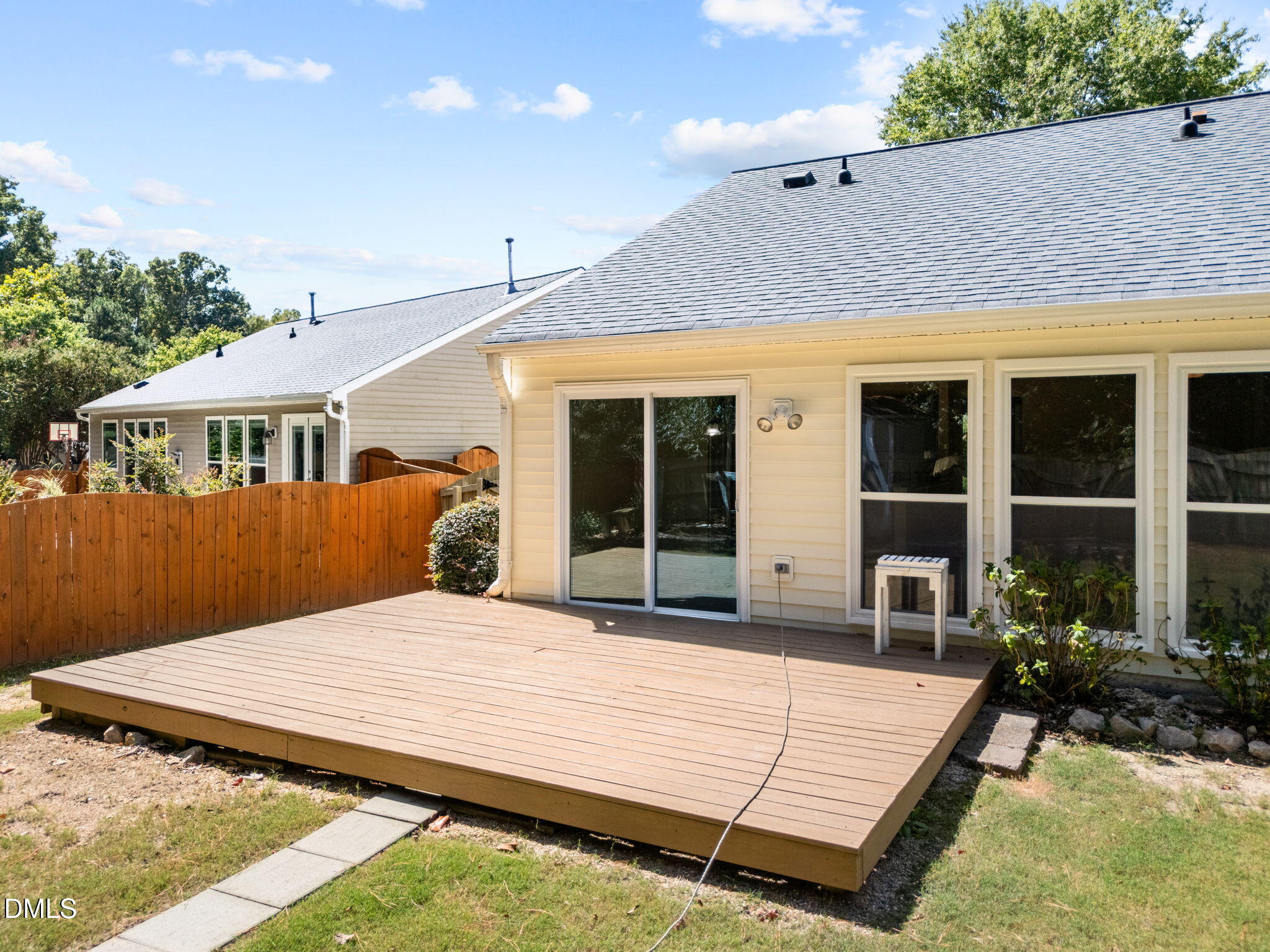 104 Saddle River Road Apex, NC 27502 - Photo 25 of 42 a view of a house with backyard porch and sitting area