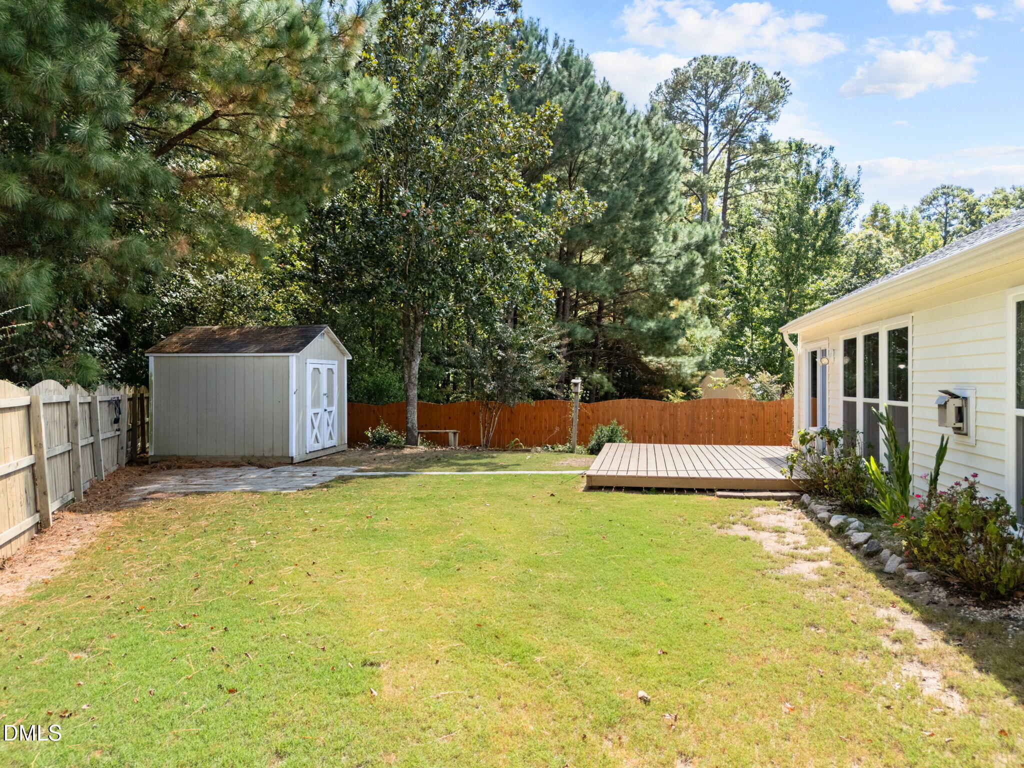 104 Saddle River Road Apex, NC 27502 - Photo 29 of 42 a view of a house with pool and sitting area