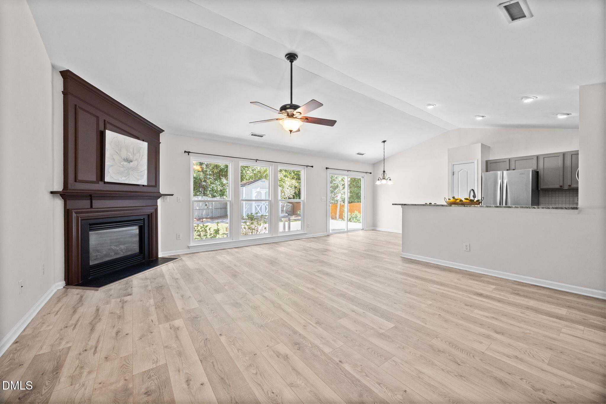 104 Saddle River Road Apex, NC 27502 - Photo 5 of 42 a view of a kitchen with a sink and a fireplace