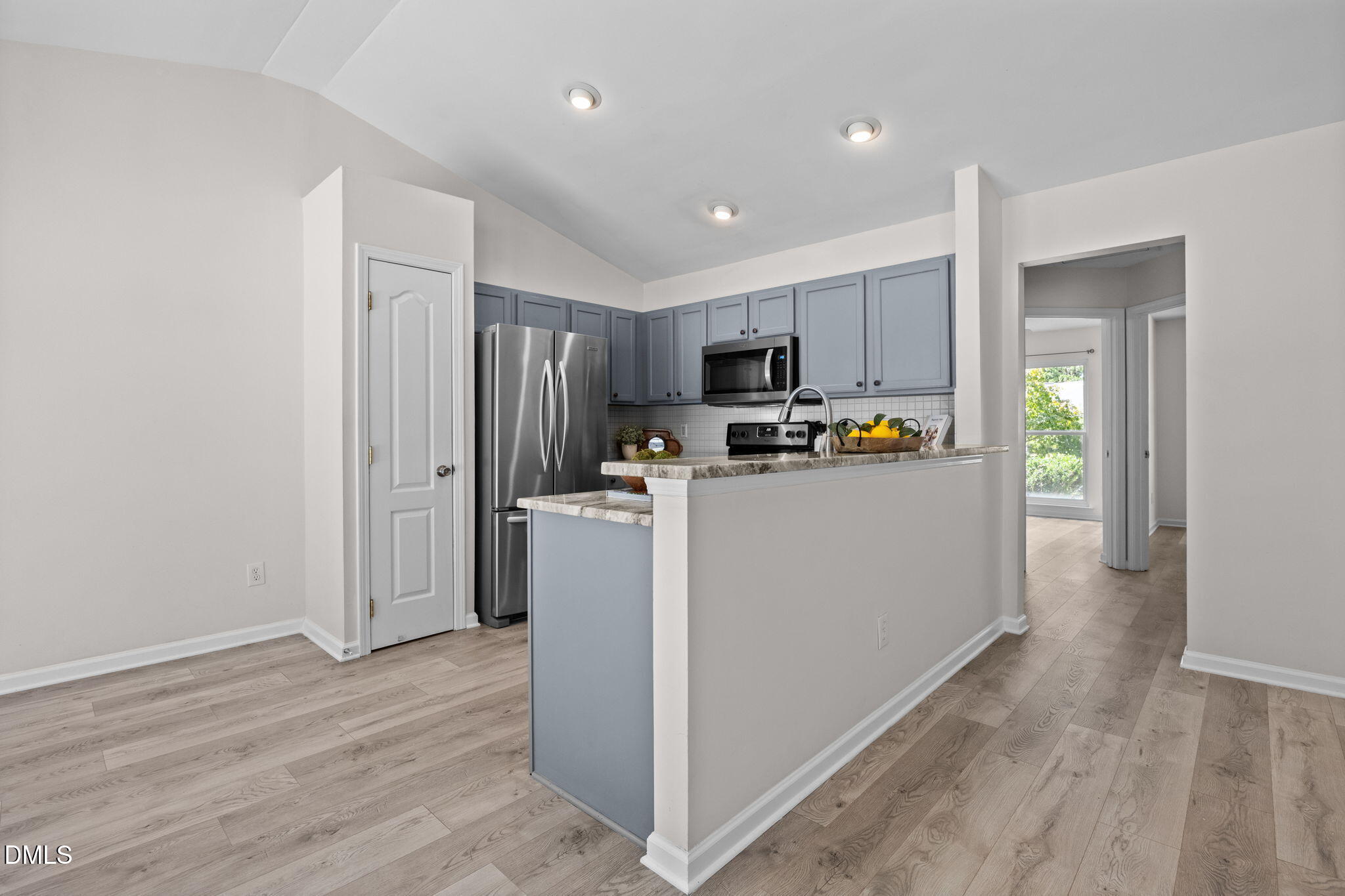 104 Saddle River Road Apex, NC 27502 - Photo 9 of 42 a view of kitchen and wooden floor