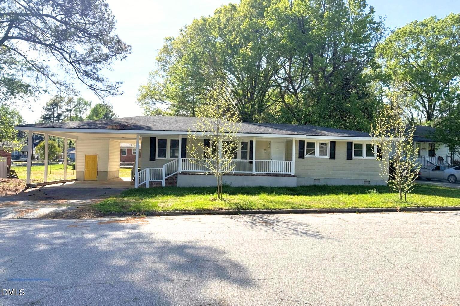 2414 Chapin Street Durham, NC 27707 - Photo 1 of 30 a front view of a house with a yard and porch