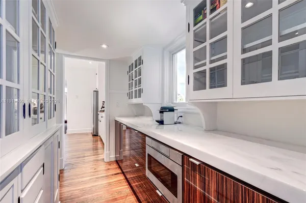 a kitchen with a sink and a refrigerator