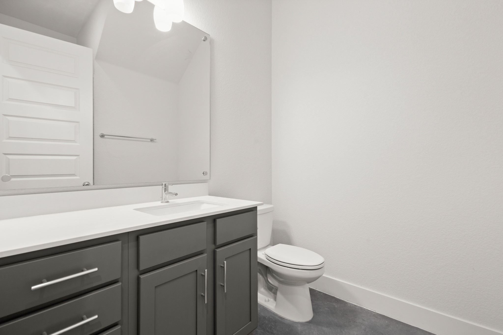8922 Manchaca Road, Unit 701 Austin, TX 78748 - Photo 11 of 25 a bathroom with a toilet a sink and mirror
