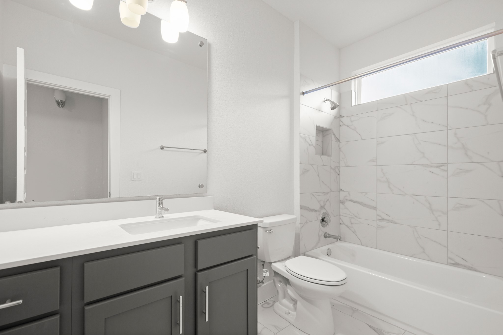 8922 Manchaca Road, Unit 701 Austin, TX 78748 - Photo 15 of 25 a bathroom with a sink a toilet and shower