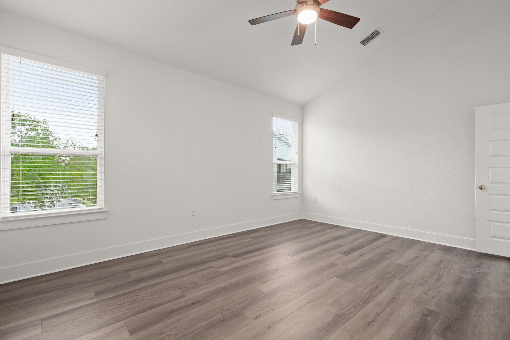 8922 Manchaca Road, Unit 701 Austin, TX 78748 - Photo 20 of 25 wooden floor in an empty room with a window