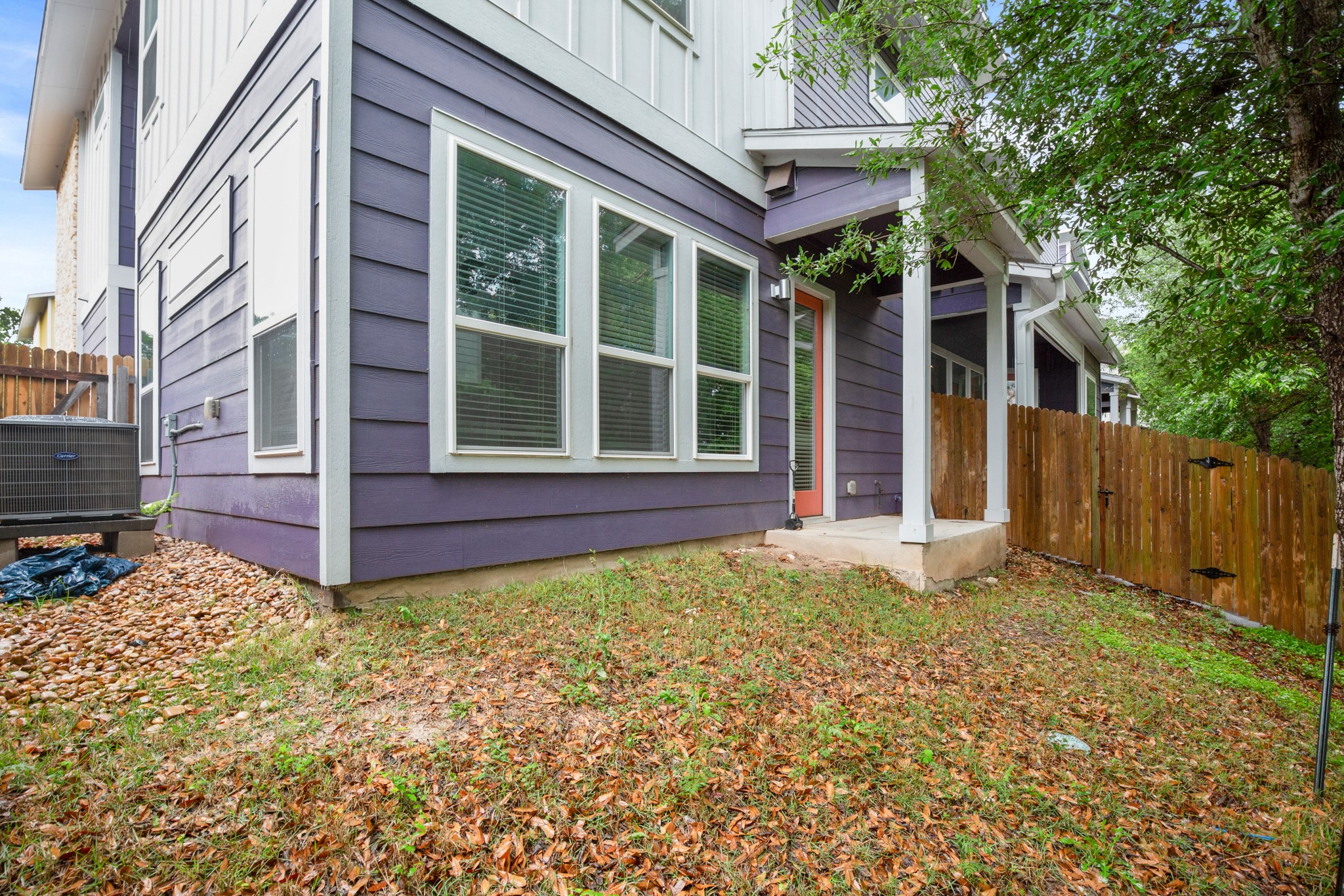 8922 Manchaca Road, Unit 701 Austin, TX 78748 - Photo 25 of 25 a view of a backyard with large trees and wooden fence