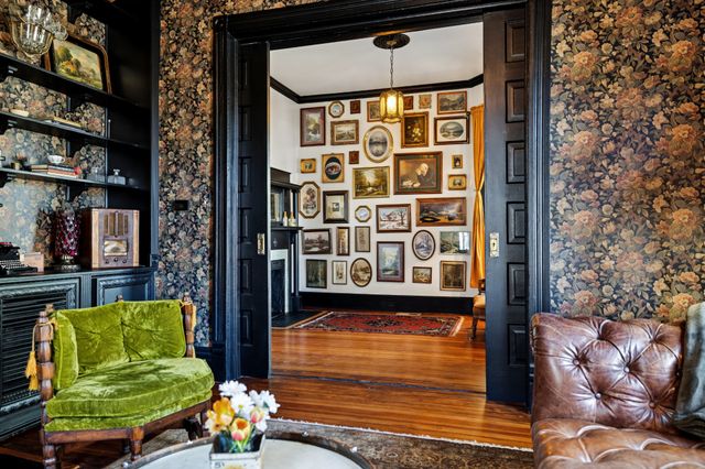 a living room with fireplace and a wooden floor