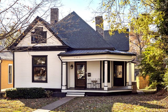 a front view of a house with a porch