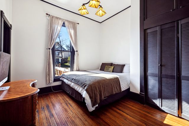 a bathroom with a sink a toilet a mirror and tub