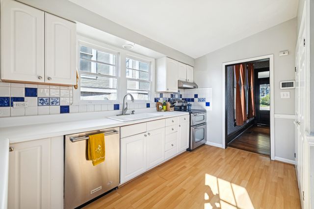 a view of a patio with a table and chairs
