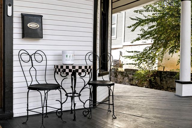 a table and chairs in front of a door
