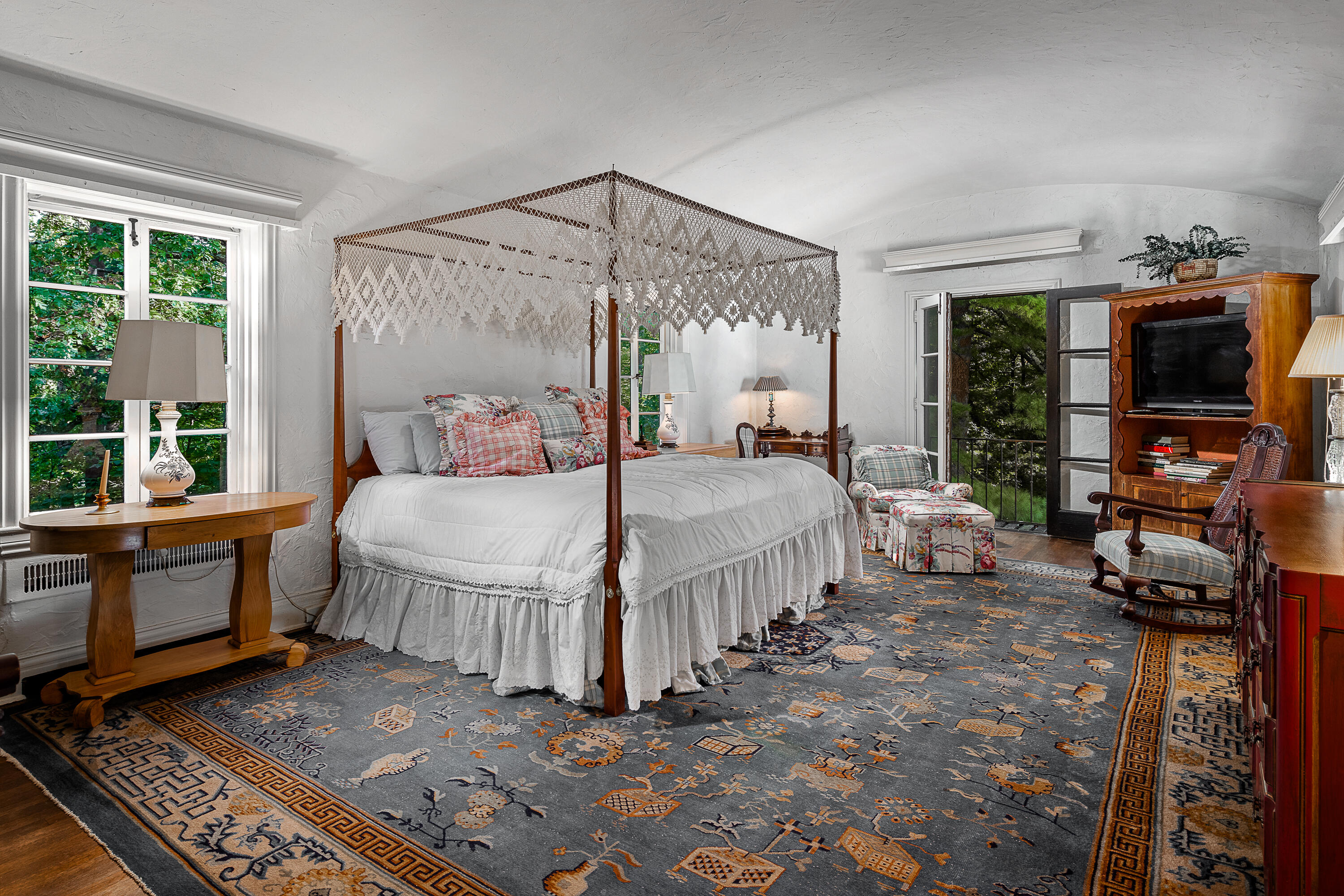 684 Westover Road Stamford, CT 06902 - Photo 13 of 25 a bedroom with a bed a large window and flat screen tv