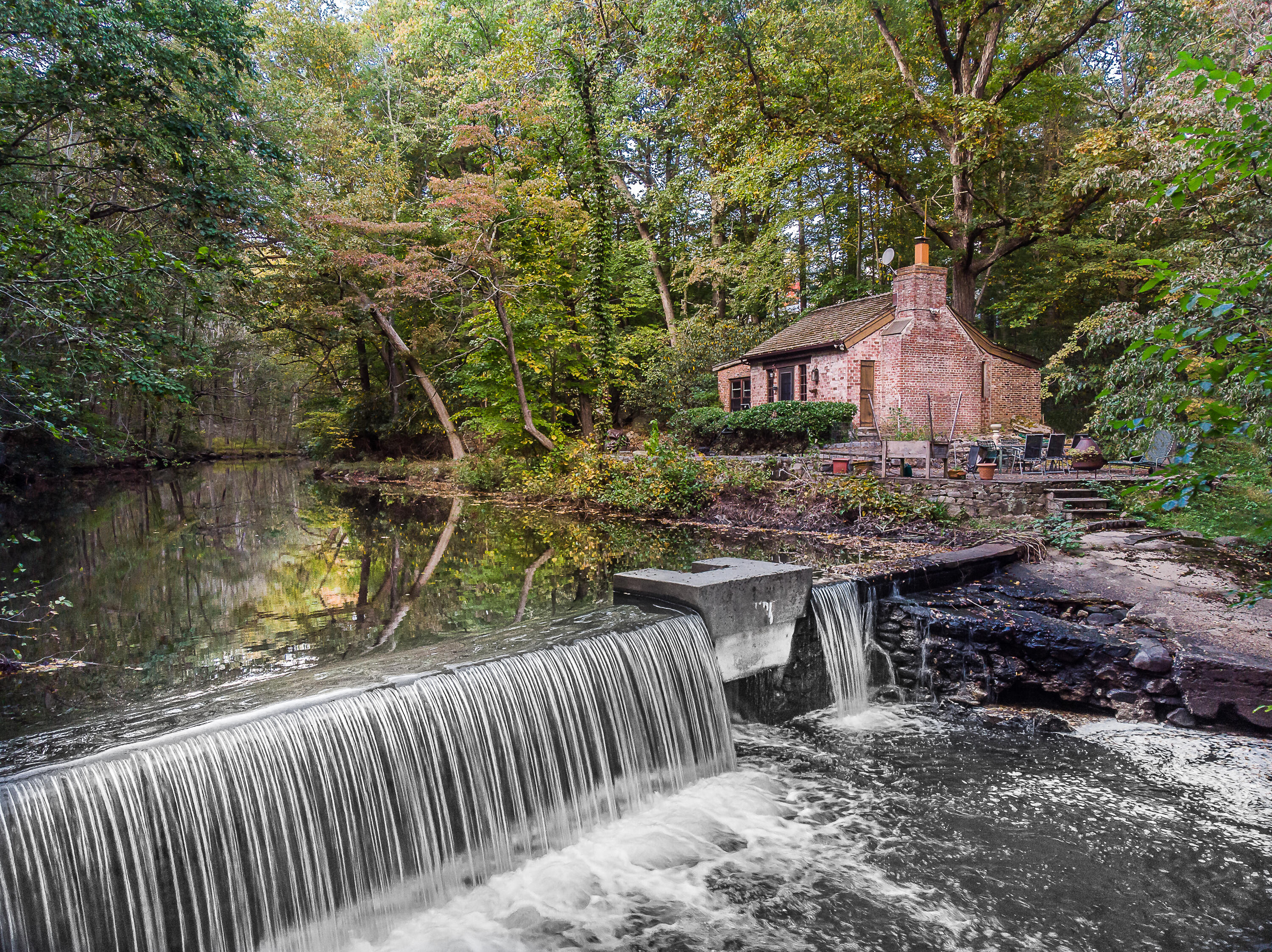 684 Westover Road Stamford, CT 06902 - Photo 20 of 25 a view of house with backyard and seating area