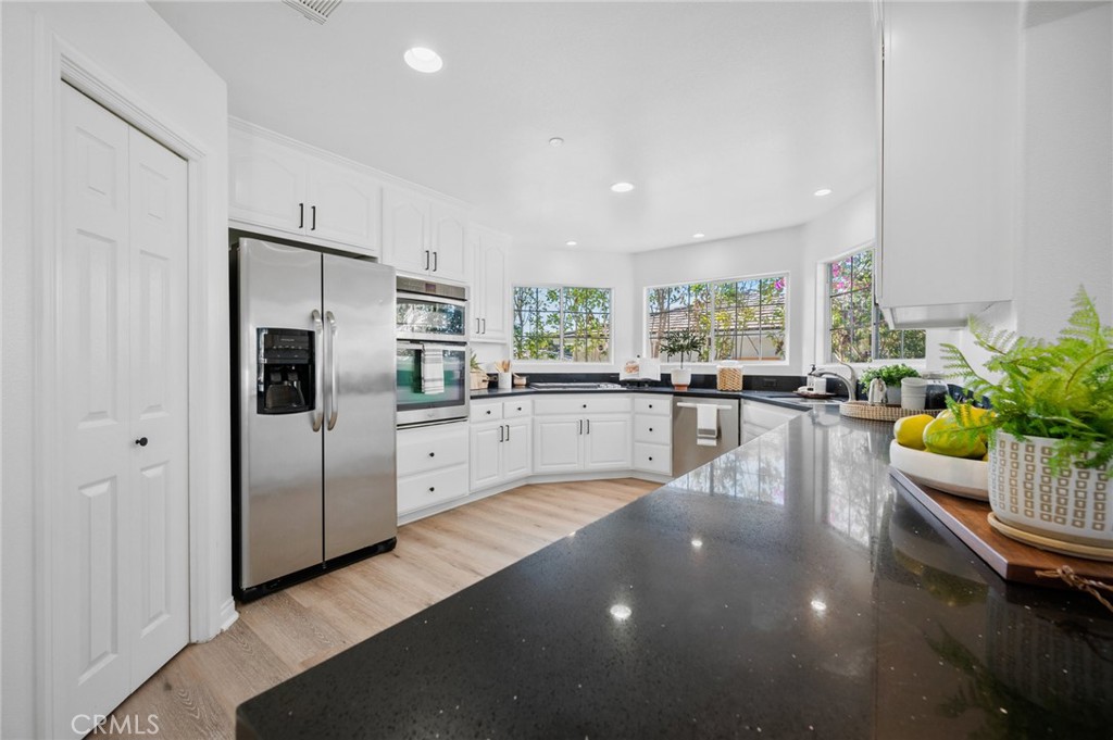 101 Esplanade San Clemente, CA 92672 - Photo 11 of 39 a large white kitchen with a large window