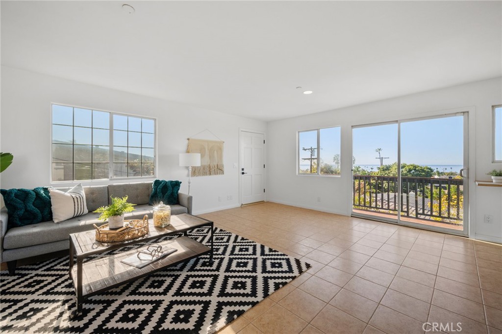 101 Esplanade San Clemente, CA 92672 - Photo 25 of 39 a living room with furniture and a floor to ceiling window