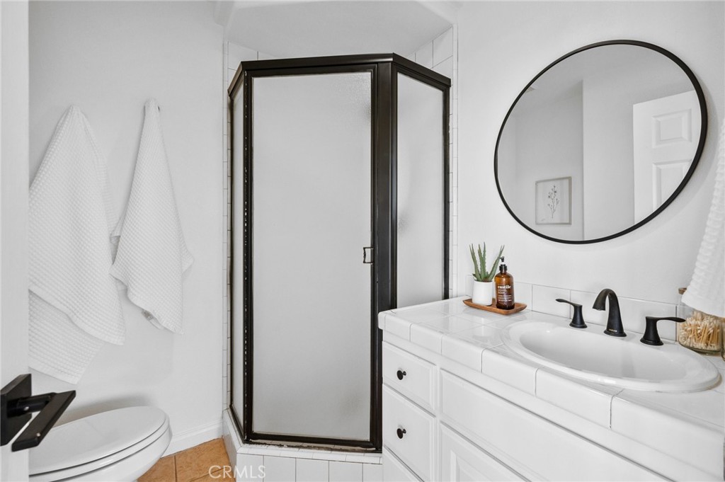 101 Esplanade San Clemente, CA 92672 - Photo 29 of 39 a bathroom with a sink a toilet and a mirror