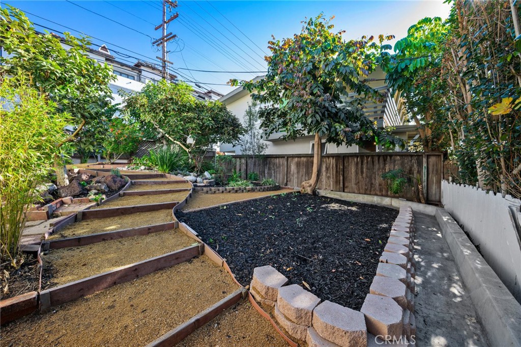 101 Esplanade San Clemente, CA 92672 - Photo 33 of 39 a view of a backyard with plants and a patio