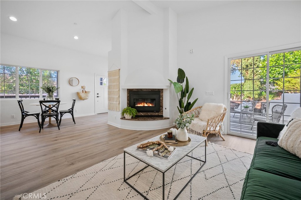 101 Esplanade San Clemente, CA 92672 - Photo 7 of 39 a living room with furniture a fireplace a rug and a large window