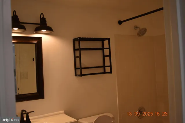 a bathroom with a toilet and a sink