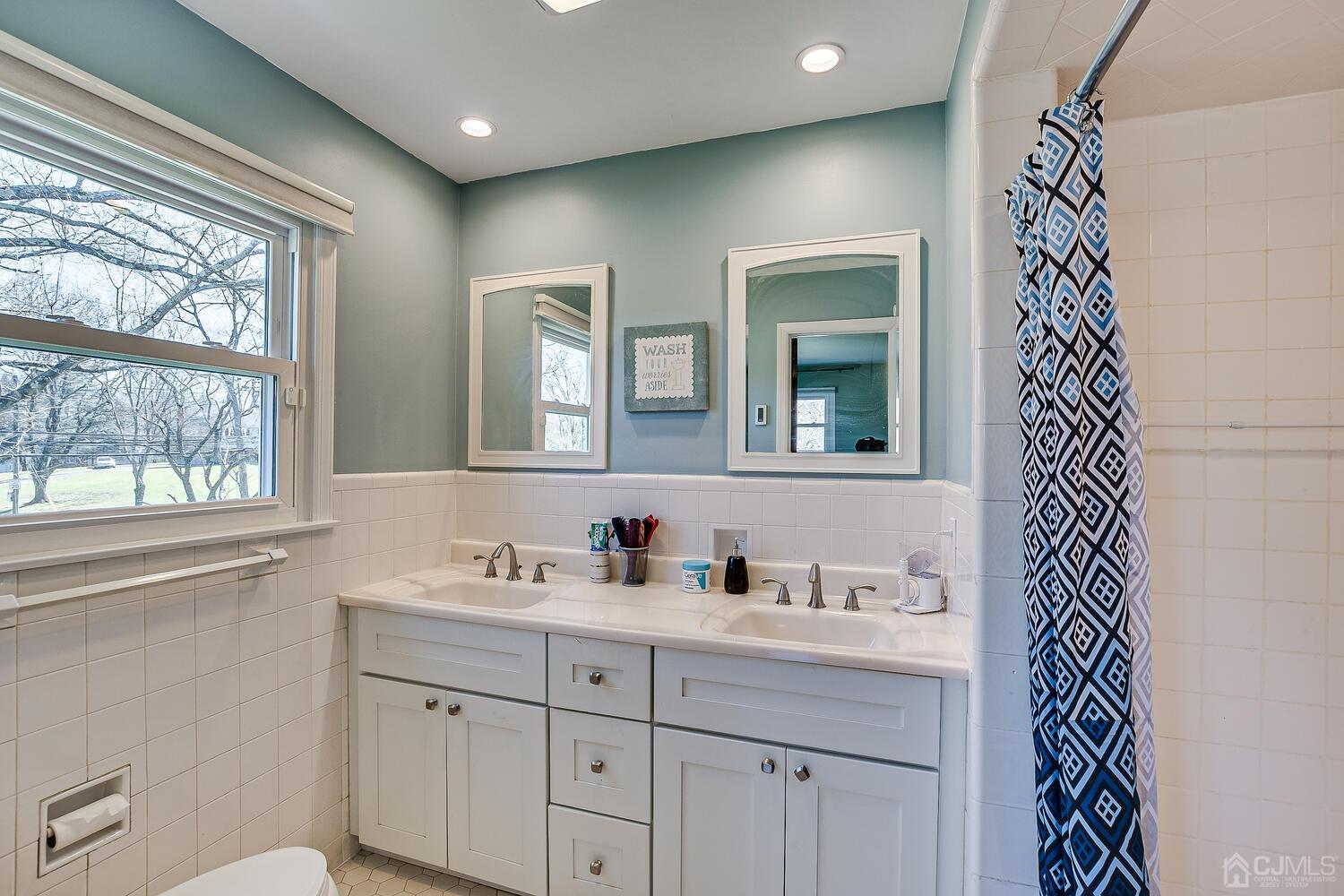 675 Country Club Road Bridgewater, NJ 08807 - Photo 38 of 58 a bathroom with a sink and a mirror