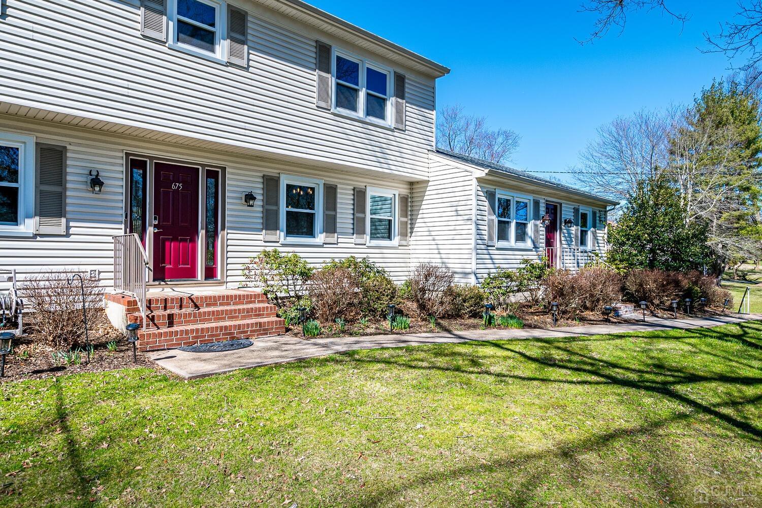 675 Country Club Road Bridgewater, NJ 08807 - Photo 5 of 58 front view of a house with a yard