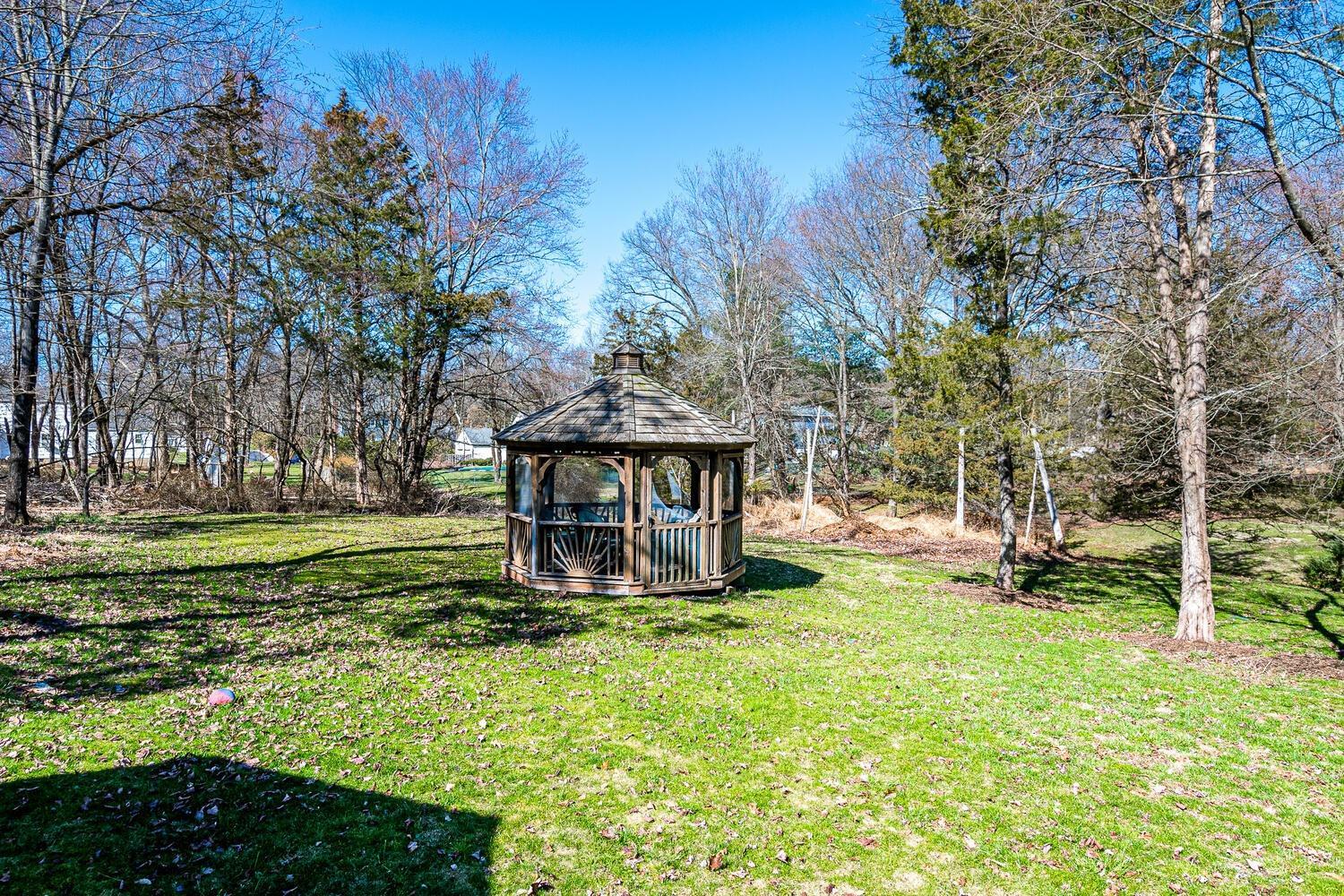 675 Country Club Road Bridgewater, NJ 08807 - Photo 54 of 58 a view of a backyard with wooden fence and large trees