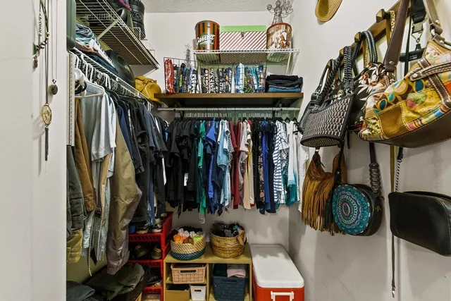 a car parked in front of white building