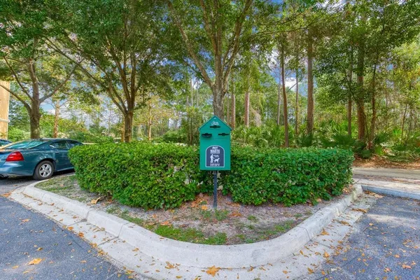 a front view of house with yard and trees