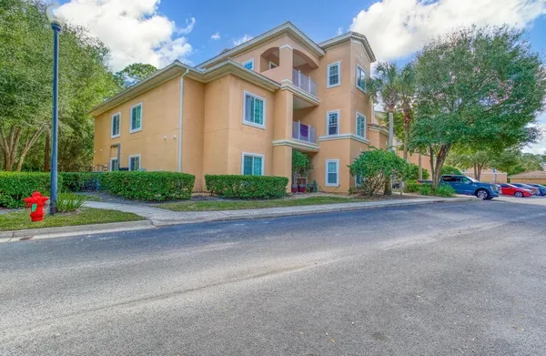 a view of a car parked in front of a house