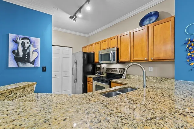 a living room with furniture and a baby crib