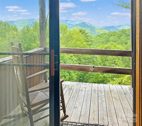 a view of balcony with wooden floor