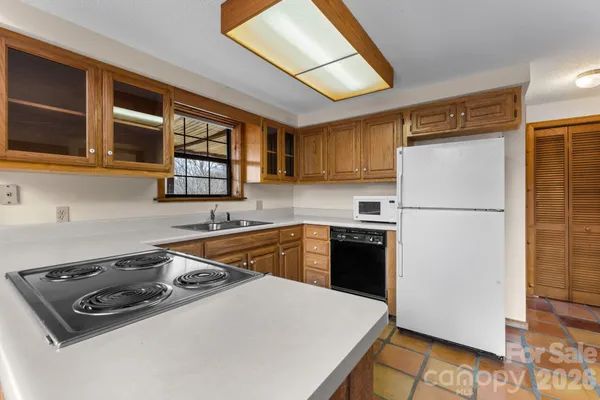 a bathroom with a sink a toilet and shower curtain
