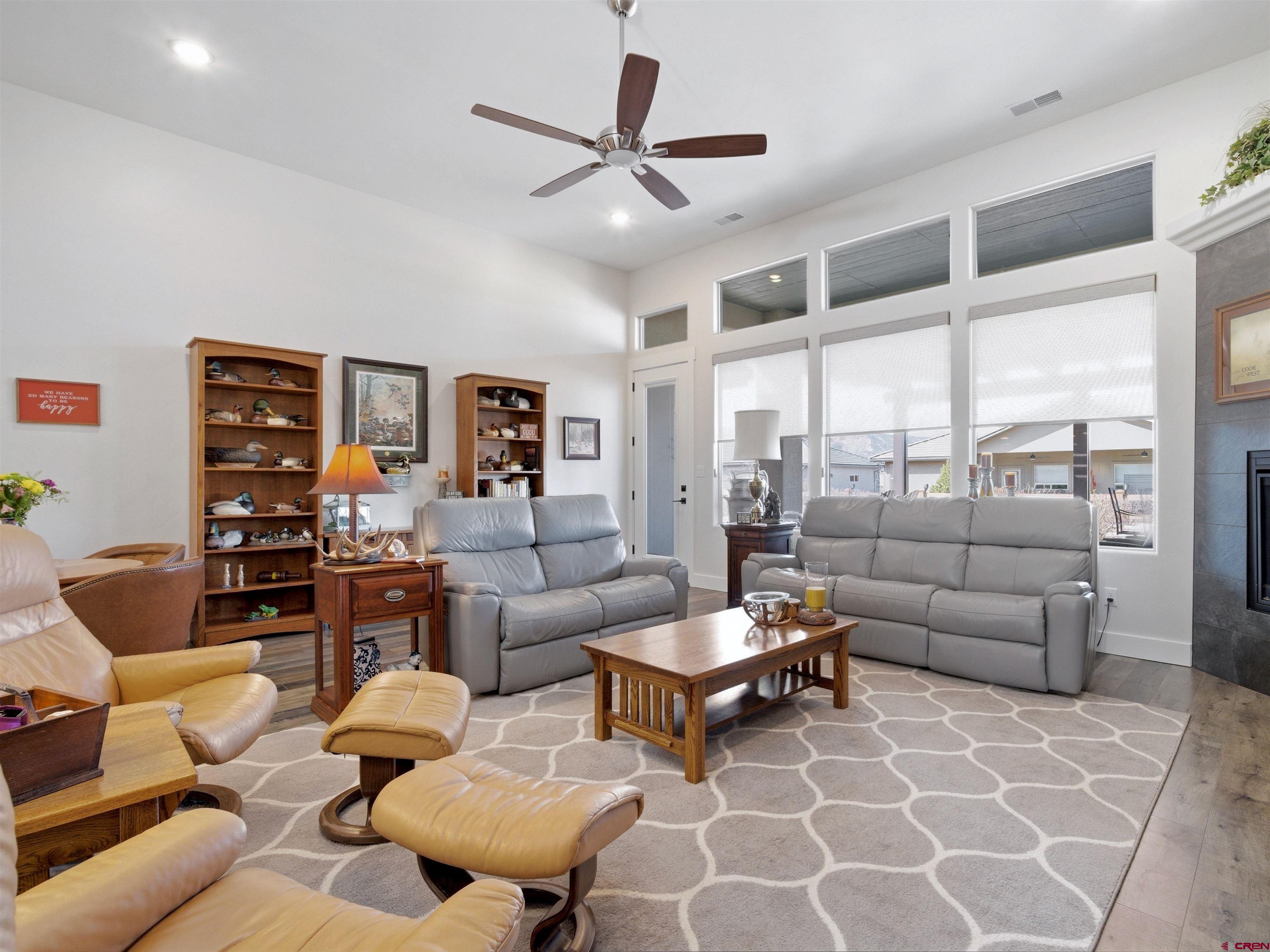 1223 Eagle Way Fruita, CO 81521 - Photo 11 of 34 a living room with furniture and a large window