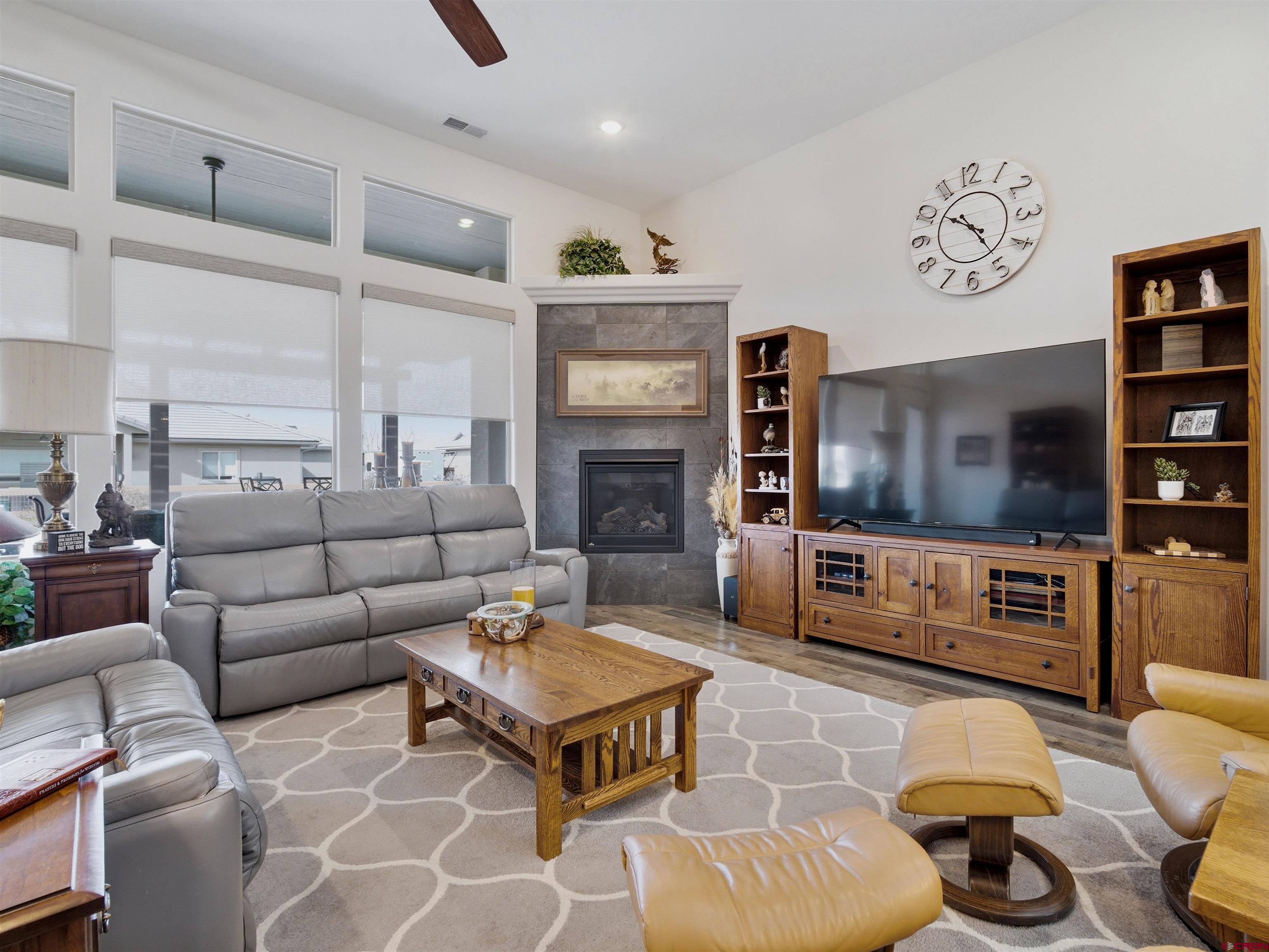 1223 Eagle Way Fruita, CO 81521 - Photo 12 of 34 a living room with furniture and a flat screen tv