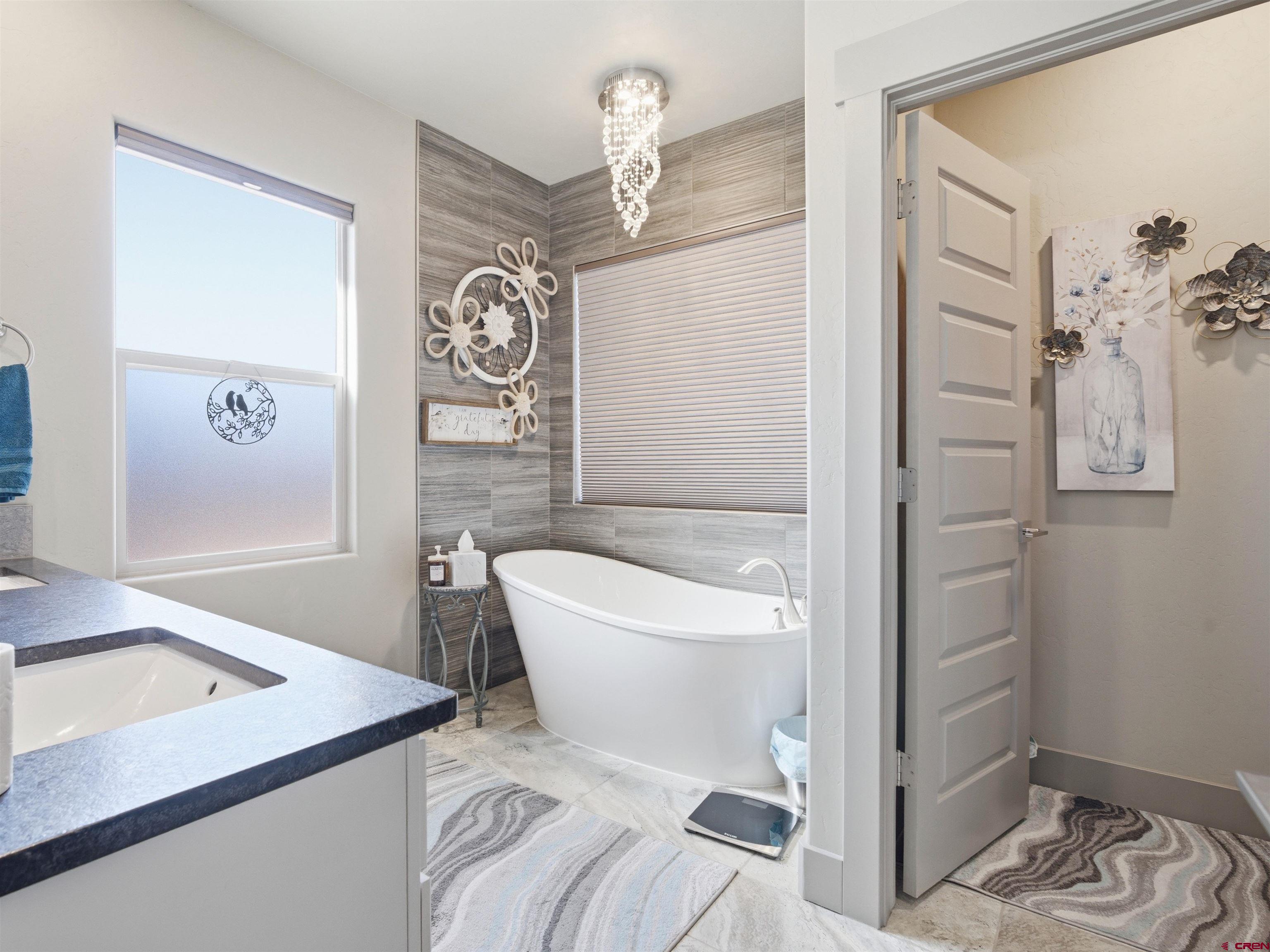 1223 Eagle Way Fruita, CO 81521 - Photo 14 of 34 a bathroom with a sink a toilet and shower