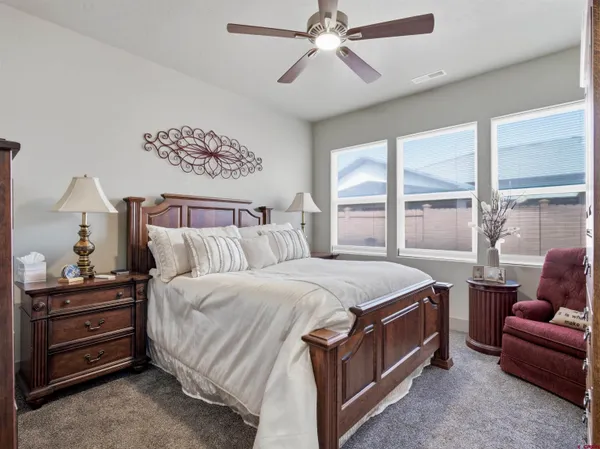 a bedroom with a bed and a couch