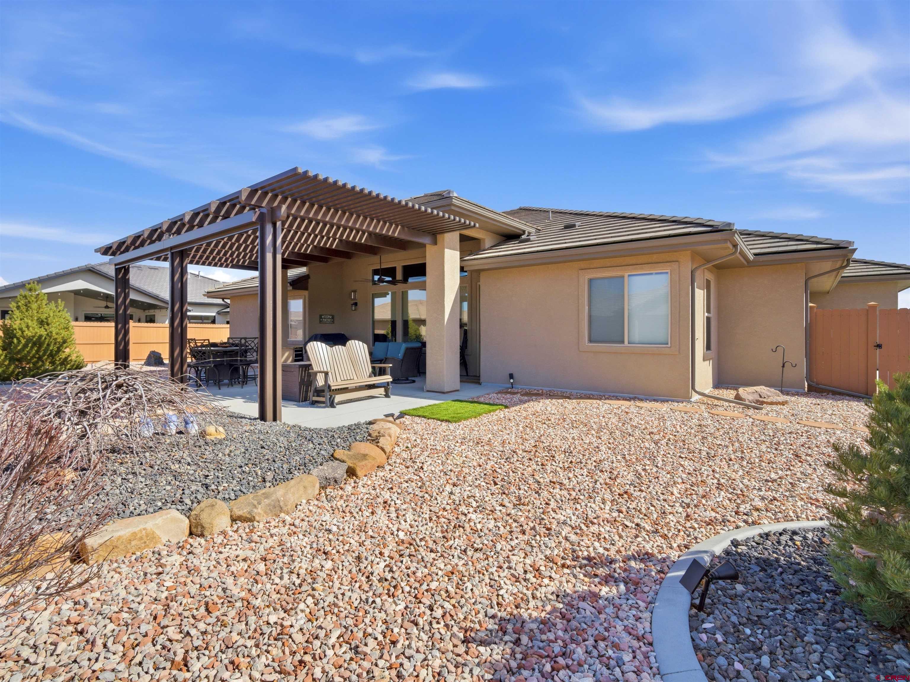 1223 Eagle Way Fruita, CO 81521 - Photo 30 of 34 a front view of a house with a yard