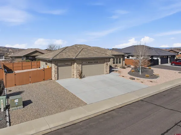 an aerial view of a house with outdoor space