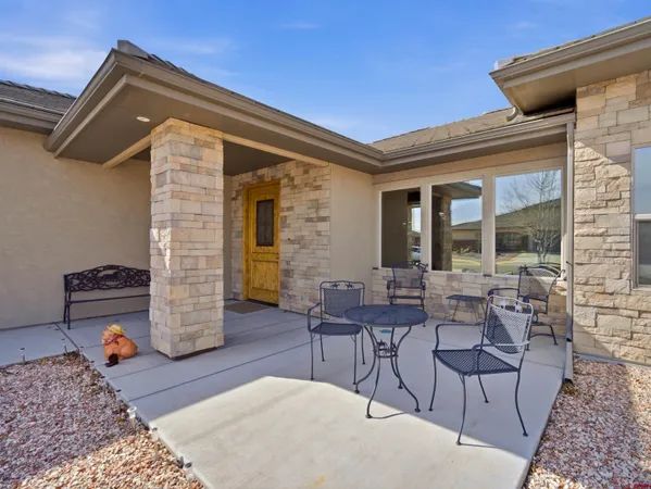a outdoor space with patio the couches and a dining table with chairs