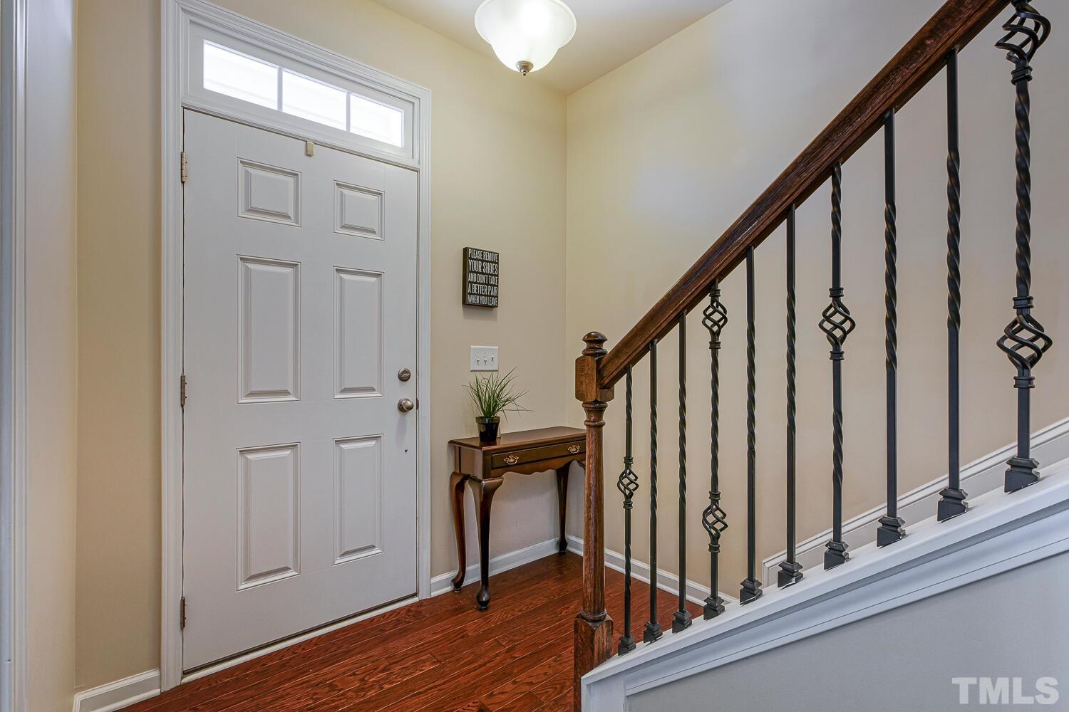 9108 Wooden Road Raleigh, NC 27617 - Photo 4 of 34 Wrought Iron Balusters and Hardwood Floors Set the Tone!