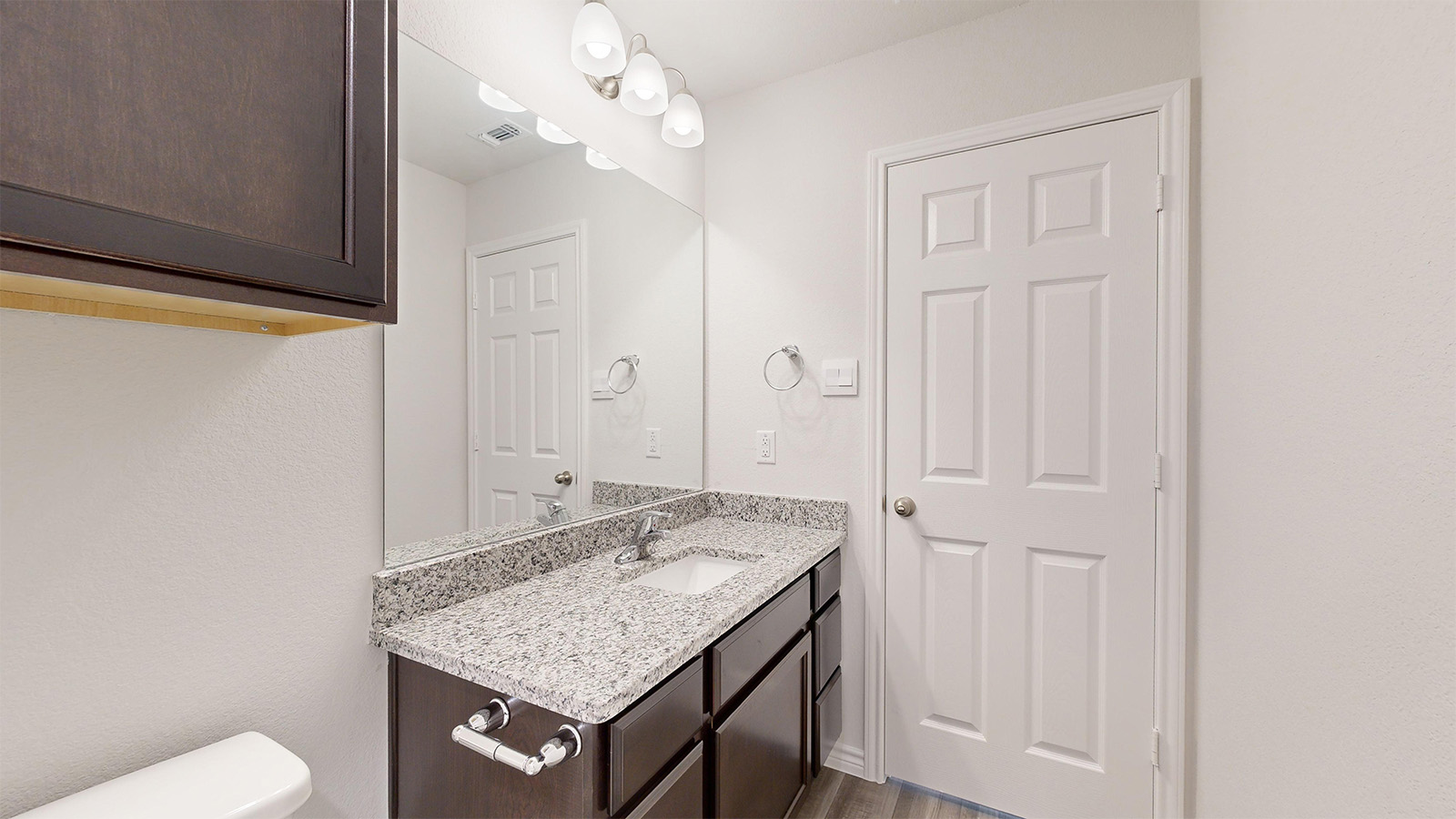 408 Creekfall Road Burnet, TX 78611 - Photo 18 of 21 a bathroom with a granite countertop sink and a mirror