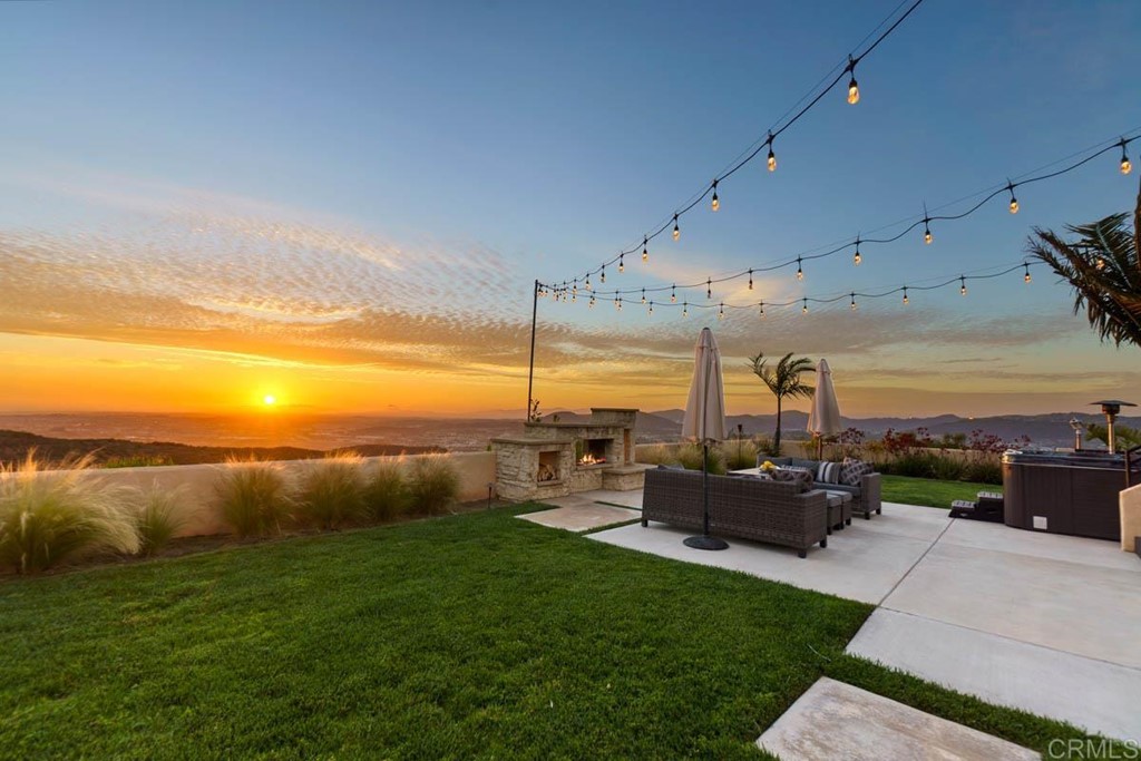 a view of a garden with lawn chairs